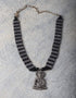 White Metal And Black Beaded Buddha Necklace