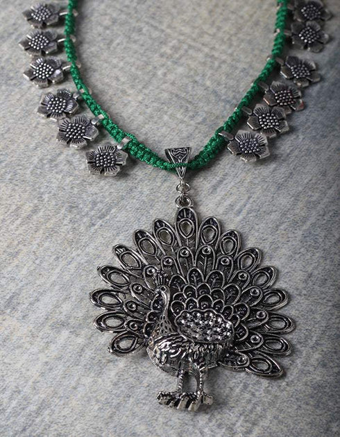 White Metal Peacock Design Necklace With Green Closure