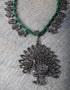 White Metal Peacock Design Necklace With Green Closure
