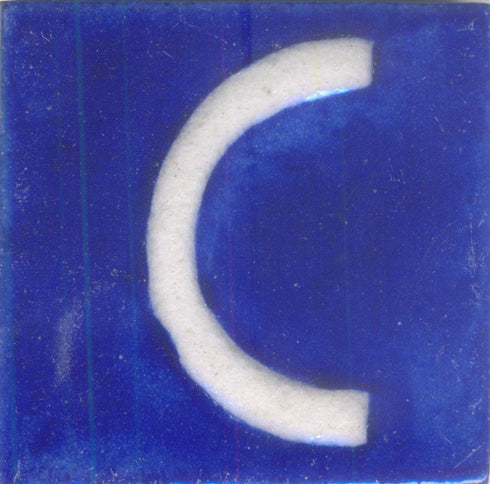 White C alphabet blue tile (2x2)