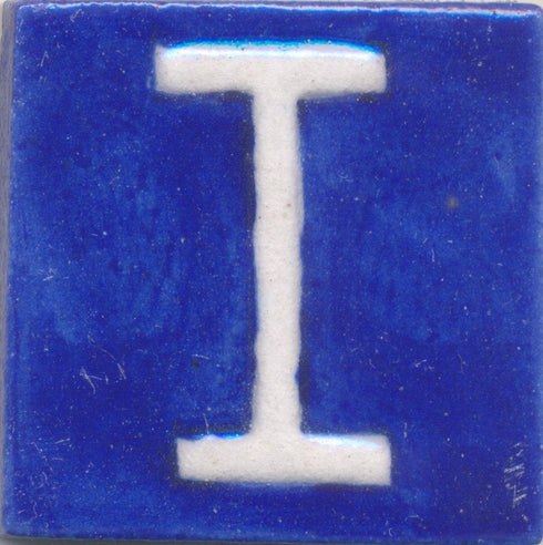 White I alphabet blue tile (2x2)