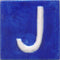 White J alphabet blue tile (2x2)