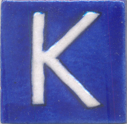 White K alphabet blue tile (2x2)