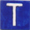 White T alphabet blue tile (2x2)