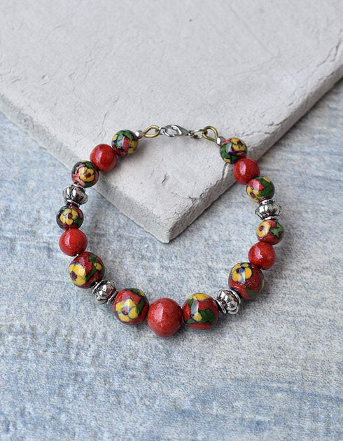 Handmade Round Bracelet With Blue Pottery Beads, Metal Beads & Hook in Red Colour Base With Yellow Flower