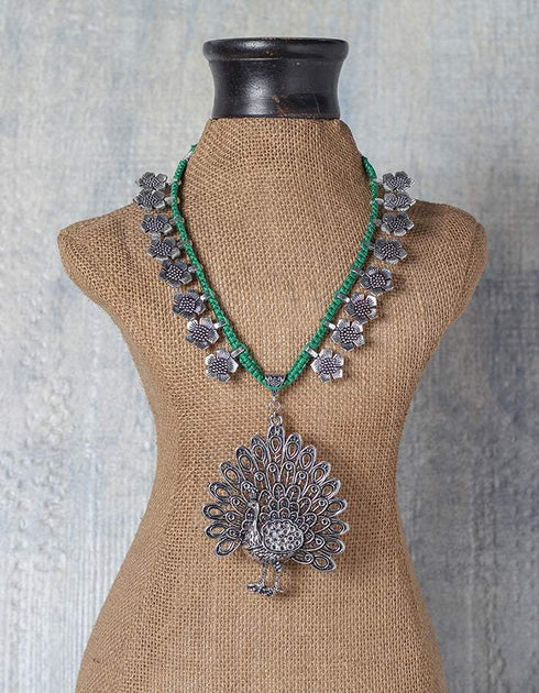 White Metal Peacock Design Necklace With Green Closure