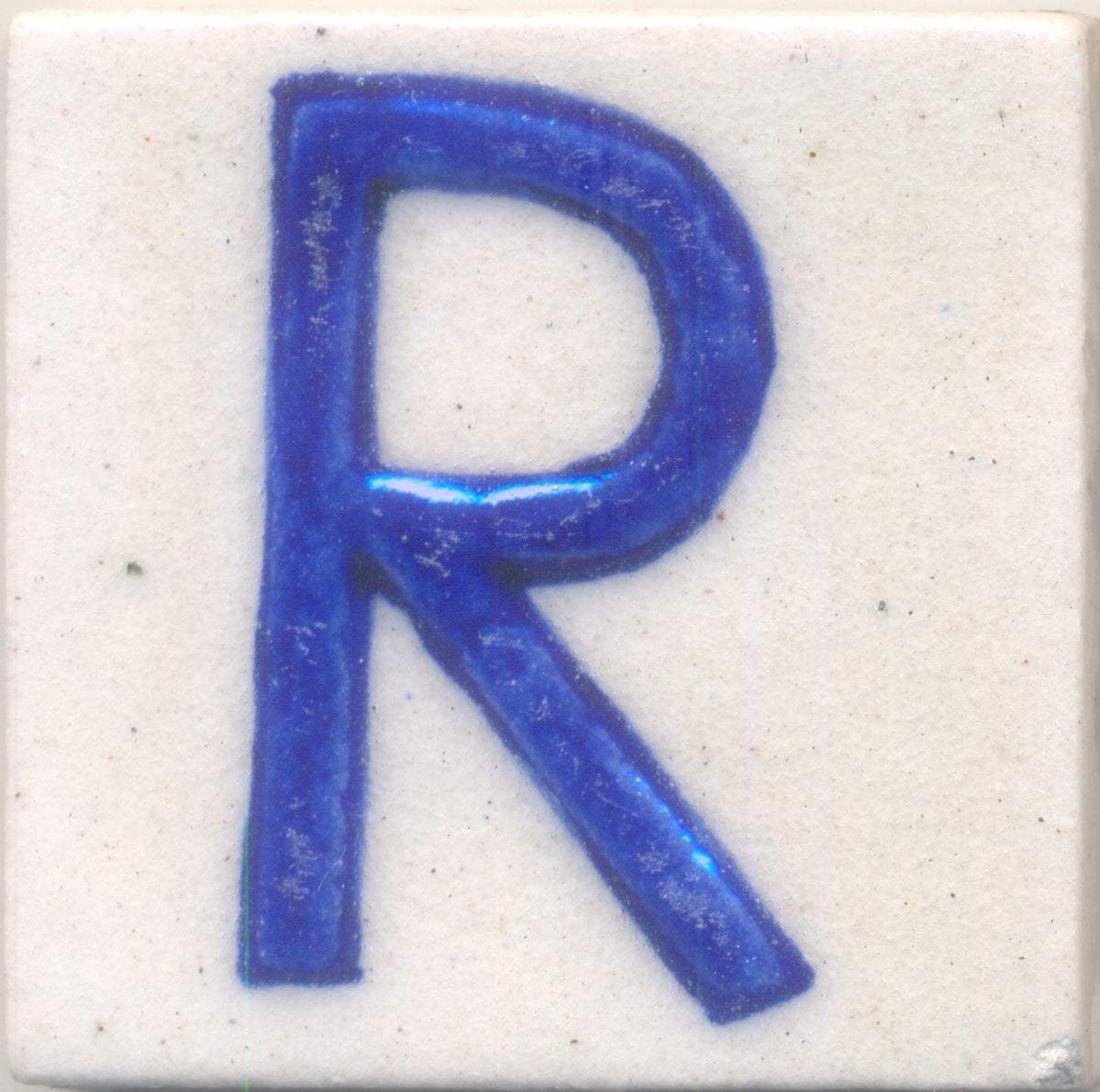 Blue R alphabet white tile (2x2) – NEERJA INTERNATIONAL INC